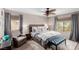 Comfortable bedroom with window, neutral paint and ceiling fan at 11237 Gallery Echo St, Las Vegas, NV 89141