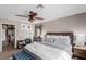Bedroom with window and closet, ceiling fan and a sitting area at 11237 Gallery Echo St, Las Vegas, NV 89141