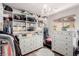 Walk in closet with shelving, chandelier and two dressers at 11237 Gallery Echo St, Las Vegas, NV 89141