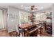 Elegant dining area with stylish seating and a view to the backyard at 11237 Gallery Echo St, Las Vegas, NV 89141