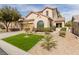 Inviting home showcasing a tidy lawn, xeriscaping, and a spacious two-car garage at 11237 Gallery Echo St, Las Vegas, NV 89141