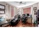 Comfortable home office setup with ergonomic seating, natural light, and hardwood floors at 11237 Gallery Echo St, Las Vegas, NV 89141