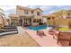 Inviting backyard pool area with lounge chairs, a pergola, and a basketball hoop for outdoor enjoyment at 11237 Gallery Echo St, Las Vegas, NV 89141