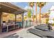 Backyard featuring a private pool, pergola, lounge chairs, and palm trees, offering a serene outdoor escape at 11237 Gallery Echo St, Las Vegas, NV 89141