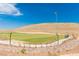 Expansive soccer field with lush green grass and clear blue sky, offering ample recreational space at 11237 Gallery Echo St, Las Vegas, NV 89141