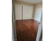 Cozy bedroom featuring a spacious closet and hardwood floors at 1150 N Buffalo Dr # 1015, Las Vegas, NV 89128
