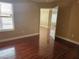Comfortable bedroom showcasing natural light and hardwood flooring at 1150 N Buffalo Dr # 1015, Las Vegas, NV 89128