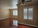 Living room showcasing hardwood floors, crown molding, ceiling fan and plantation shutters at 1150 N Buffalo Dr # 1015, Las Vegas, NV 89128