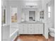 Elegant bathroom features a double vanity, separate tub, and shower, providing a luxurious spa-like experience at 11820 Calle De Sol Dr, Las Vegas, NV 89138