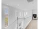 Bright hallway with white walls and ample natural light, offering a clean and airy transition between spaces at 11820 Calle De Sol Dr, Las Vegas, NV 89138