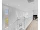 Bright and airy hallway featuring white railings and natural light at 11820 Calle De Sol Dr, Las Vegas, NV 89138