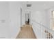 Bright upstairs hallway with white railings and access to other rooms at 11820 Calle De Sol Dr, Las Vegas, NV 89138