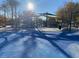Large playground area with black metal shade structures, playground equipment, and cushioned flooring at 11820 Calle De Sol Dr, Las Vegas, NV 89138