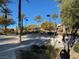 Sand volleyball court in a park with palm trees, landscaping, walking paths, and lights at 11820 Calle De Sol Dr, Las Vegas, NV 89138