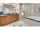 The primary bathroom features a separate glass shower, soaking tub, and dual sink vanity at 145 E Harmon Ave # 2917, Las Vegas, NV 89109