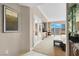 Refined hotel bedroom boasting a king bed, well-lit desk area, and a balcony with city views at 145 E Harmon Ave # 2917, Las Vegas, NV 89109
