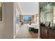 Elegant hotel suite with a king-size bed, desk, and views of the city from a private balcony at 145 E Harmon Ave # 2917, Las Vegas, NV 89109