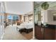 Luxurious hotel room featuring a king bed, workspace, and a balcony with expansive city views at 145 E Harmon Ave # 2917, Las Vegas, NV 89109