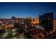 Night view of the city skyline, featuring the Hilton Grand Vacations and other glowing hotels at 145 E Harmon Ave # 2917, Las Vegas, NV 89109