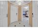 Hallway with neutral colored walls and doors, plus bedroom entrance, and tile floors at 145 E Harmon Ave # 2917, Las Vegas, NV 89109