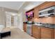 This suite includes a kitchenette featuring dark countertops and wooden cabinetry at 145 E Harmon Ave # 2917, Las Vegas, NV 89109