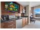 Kitchenette area with sink, microwave, and mini fridge, complemented by a table and city view at 145 E Harmon Ave # 2917, Las Vegas, NV 89109