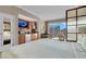 Hotel room kitchenette with wooden cabinets, stainless steel appliances, and a view of the city at 145 E Harmon Ave # 2917, Las Vegas, NV 89109