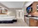 Bright living room with kitchenette features a flat-screen TV and access to the bathroom at 145 E Harmon Ave # 2917, Las Vegas, NV 89109
