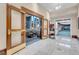 Elegant lobby entrance with marble floors, wood-framed glass doors, and a view into a lounge area at 145 E Harmon Ave # 2917, Las Vegas, NV 89109