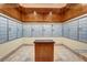 Community mail room with individual mailboxes and a wood table in the center at 145 E Harmon Ave # 2917, Las Vegas, NV 89109