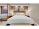 Bright main bedroom with neutral decor, lamps, and wall art at 145 E Harmon Ave # 2917, Las Vegas, NV 89109