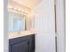 Bathroom featuring a gray vanity and a door leading to the exterior at 172 Cloudcrest Dr, Henderson, NV 89015
