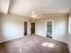 Bedroom featuring neutral carpeting, a ceiling fan, closet, and bathroom access at 172 Cloudcrest Dr, Henderson, NV 89015