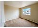 Bedroom featuring neutral paint, carpet and window with a view at 172 Cloudcrest Dr, Henderson, NV 89015