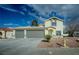 Charming home featuring a two-car garage with a spacious driveway and simple desert landscaping at 172 Cloudcrest Dr, Henderson, NV 89015