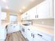 Bright kitchen with white cabinetry, modern appliances, and plenty of counter space for cooking at 172 Cloudcrest Dr, Henderson, NV 89015