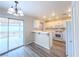 Bright eat-in kitchen with white cabinets and modern appliances at 172 Cloudcrest Dr, Henderson, NV 89015