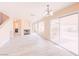 Bright living area with vinyl flooring, fireplace and sliding doors to the backyard at 172 Cloudcrest Dr, Henderson, NV 89015