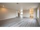 Bright and spacious living room with modern light gray flooring, neutral walls, and recessed lighting at 172 Cloudcrest Dr, Henderson, NV 89015