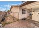 View of home's backyard with a brick patio and fenced-in area at 212 N Torrey Pines Dr, Las Vegas, NV 89107