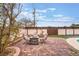 This backyard features a brick patio and outdoor firepit, perfect for enjoying cool desert evenings at 212 N Torrey Pines Dr, Las Vegas, NV 89107