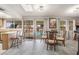 Dining area with a glass table, chairs and bar with a view of the backyard pool at 212 N Torrey Pines Dr, Las Vegas, NV 89107