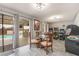 Cozy dining area with sliding door access to the pool and an arcade game collection at 212 N Torrey Pines Dr, Las Vegas, NV 89107