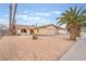 Charming single-story home with desert landscaping, a two-car garage, and a well-maintained yard at 212 N Torrey Pines Dr, Las Vegas, NV 89107