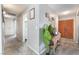 Hallway featuring tile flooring, neutral walls and an exterior door at 212 N Torrey Pines Dr, Las Vegas, NV 89107
