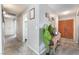 Inviting hallway with tiled floor leading to bedrooms and bathrooms at 212 N Torrey Pines Dr, Las Vegas, NV 89107