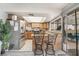 Bright kitchen featuring stainless steel appliances, breakfast bar, and sliding glass doors to outdoor patio at 212 N Torrey Pines Dr, Las Vegas, NV 89107
