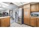 Spacious kitchen featuring stainless steel refrigerator and appliances and tile flooring at 212 N Torrey Pines Dr, Las Vegas, NV 89107