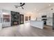 Inviting living space with sleek wood-look floors, modern fireplace, and an open layout at 2120 Maple Springs St, Henderson, NV 89002