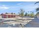 Large backyard with mature landscaping, rock ground cover, and block wall at 2221 Mohawk St, Las Vegas, NV 89146